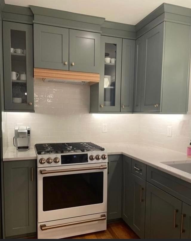 new kitchen with gray cabinets and white subway tiles