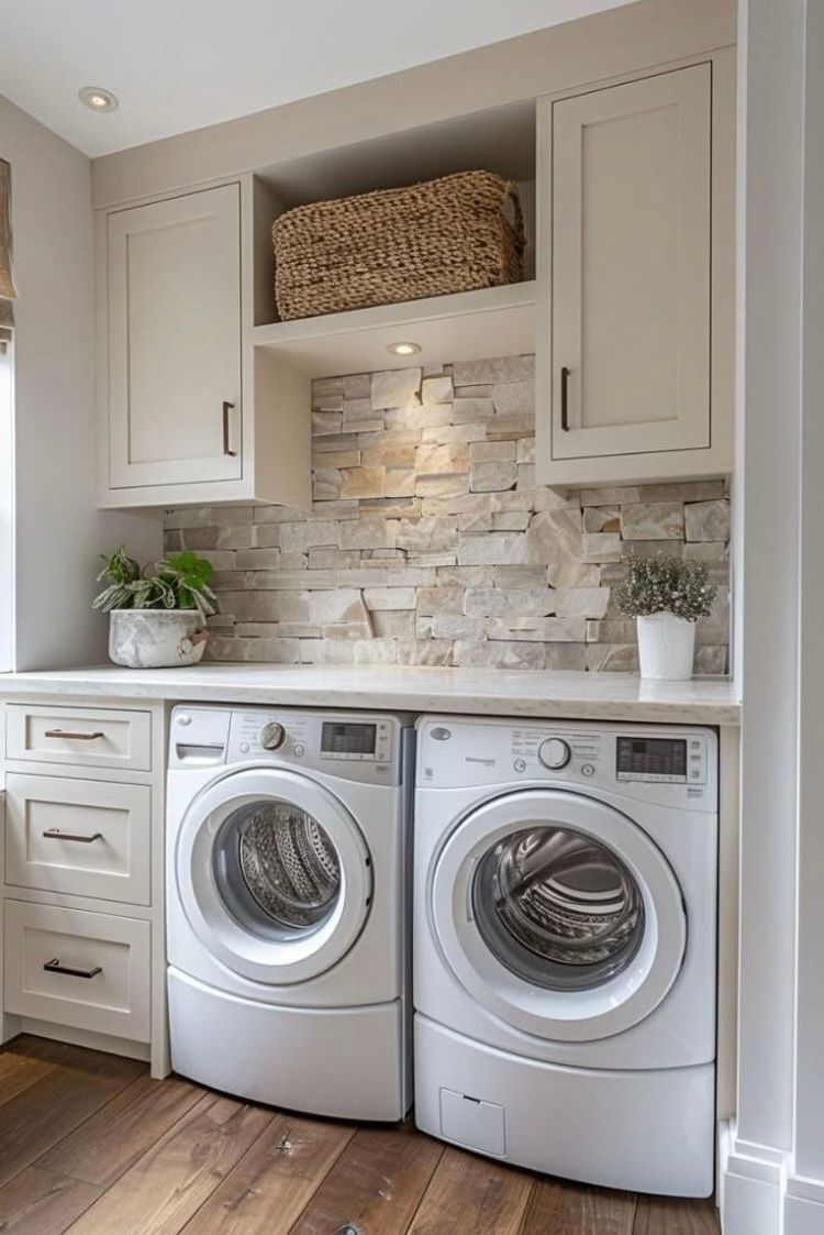 A laundry room with a washer and dryer in it.