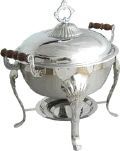 A silver chafing dish with wooden handles on a white background.
