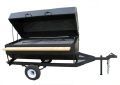 A grill on a trailer with the lid open on a white background.