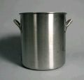 A stainless steel pot with two handles is sitting on a table.