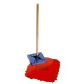 A red mop with a wooden handle is sitting on top of a red block.