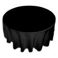 A round table with a black tablecloth on it.
