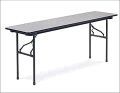 A long folding table with a metal frame on a white background.