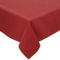 A red table cloth is sitting on top of a white table.