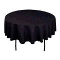 A round table with a black tablecloth on it.