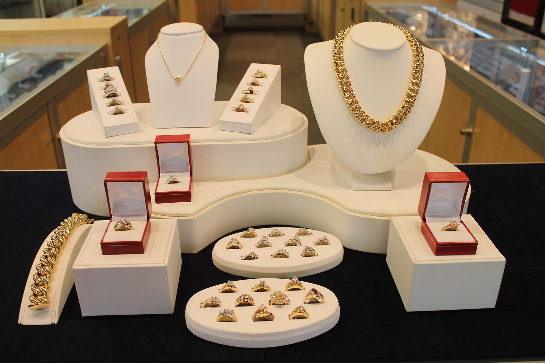 A display of jewelry including necklaces bracelets and rings