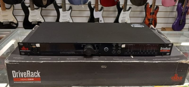 A drive rack is sitting on top of a box in a store.