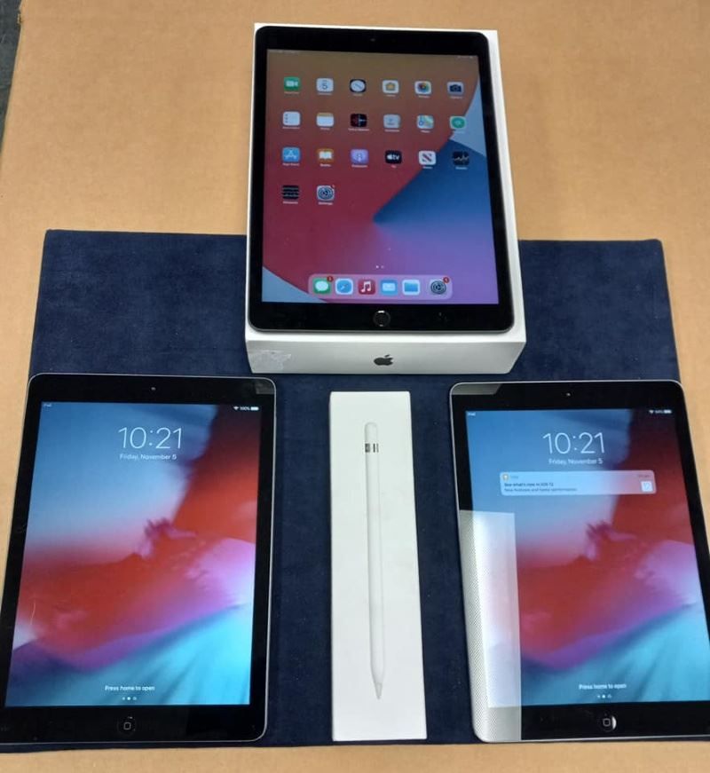 Two ipads and an apple pencil on a table