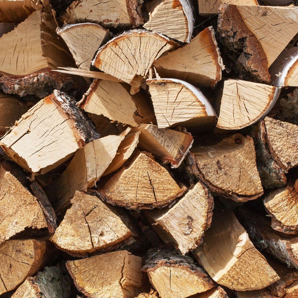 A pile of chopped wood is stacked on top of each other