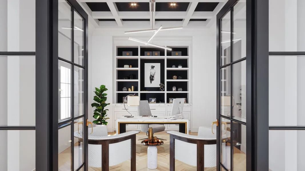 Home office with french doors and a built-in bookshelf.