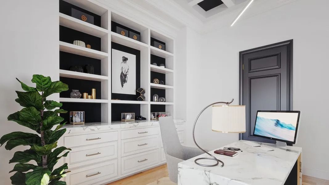 Home office with white built-in shelves, desk, and chair; plant in the corner; black door.