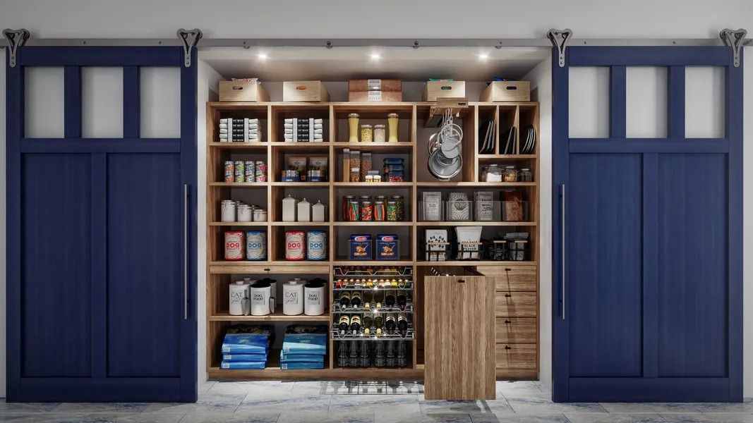 Navy blue pantry doors open to reveal a well-stocked pantry with shelves of food items.