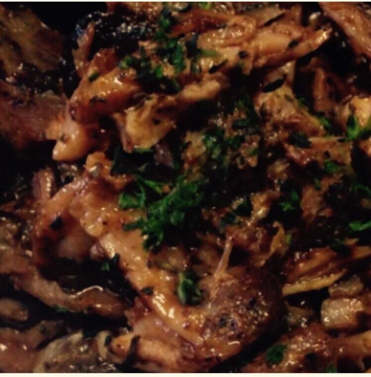 Sautéed mushrooms and onions, garnished with parsley.
