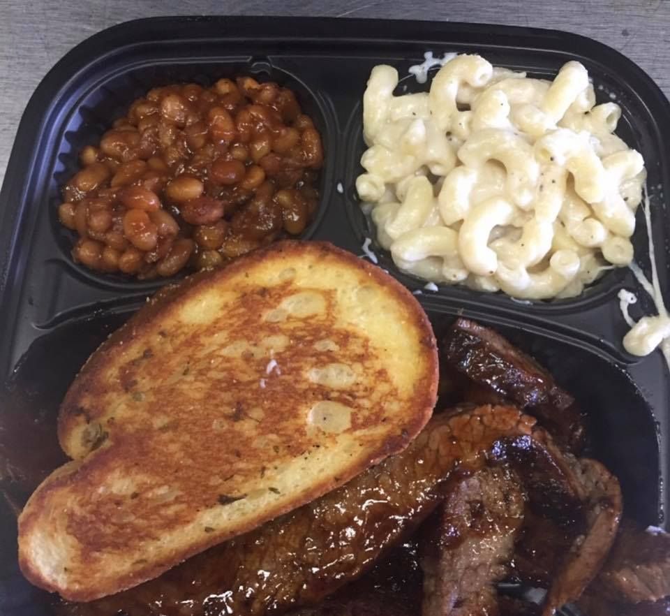 Barbecue plate: Brisket, macaroni and cheese, baked beans, and buttered toast.