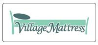 Village Mattress logo in green script with a mattress icon on a white background