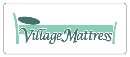 Village Mattress logo in teal text on a white background with a green underline and dark oval accent