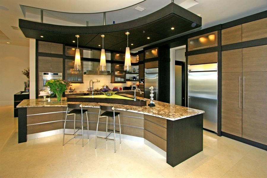 A kitchen with granite counter tops and stainless steel appliances