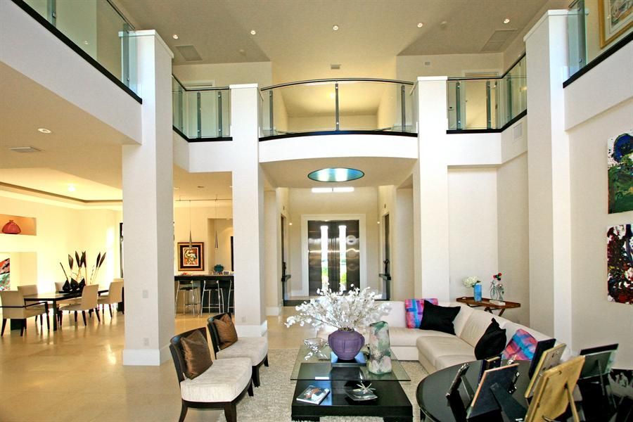 A living room filled with furniture and a balcony