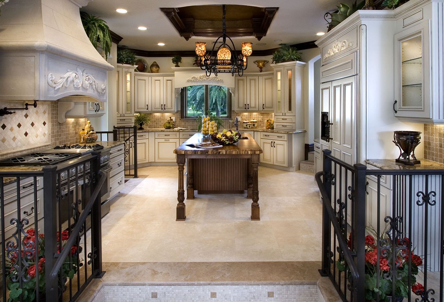 A kitchen with white cabinets and a large island