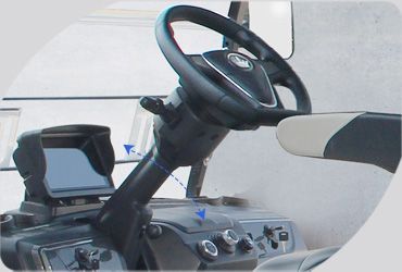 A close up of a steering wheel and dashboard of a vehicle