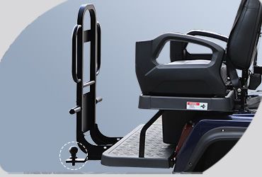A picture of a golf cart with a chair attached to it.