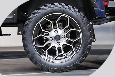 A close up of a car wheel with a tire on it