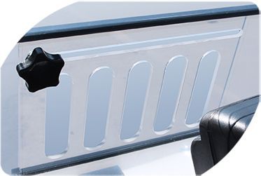 A close-up of a windshield protector on a golf cart.