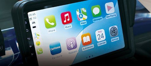 A car radio with a lot of apps on it.