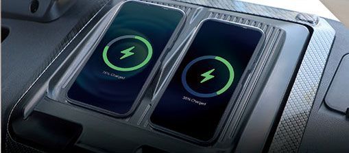 Two phones are being charged in a wireless charger.