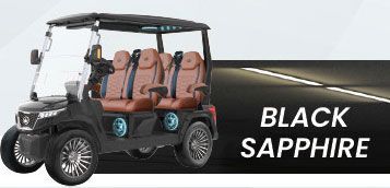 A black golf cart is parked on the side of a road.