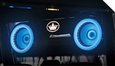 A pair of blue speakers with a crown on them