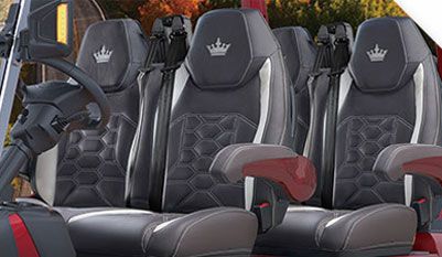 The seats are black and white and have crowns on them.