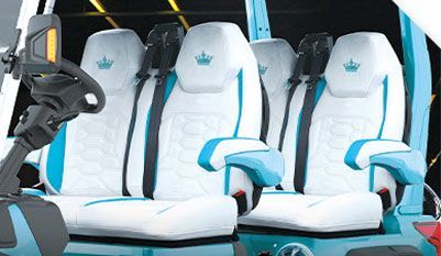 The seats are white and blue and have a crown on them.