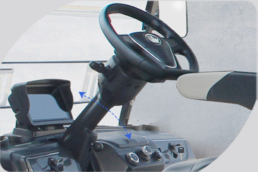 A close up of a steering wheel in a car