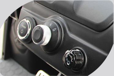 A close up of a car dashboard with a few buttons on it
