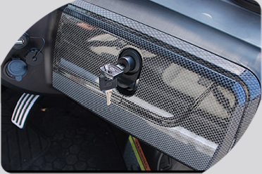 A close up of a car dashboard with a key in it