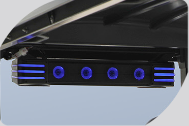 A close up of a speaker with blue lights on it