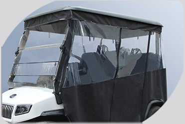 A white golf cart with a clear windshield