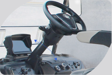 A close up of a steering wheel in a car