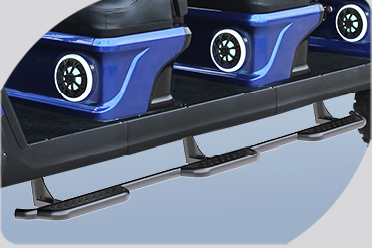 A picture of a blue golf cart with steps and speakers.