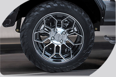 A close up of a car wheel with a tire on it