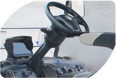 A close-up of a steering wheel on a golf cart.
