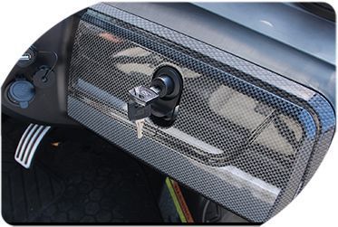 a close-up of the dashboard of a golf cart with a key in it.