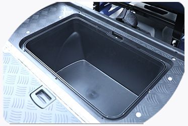 A black container with a handle on the side of a golf cart.