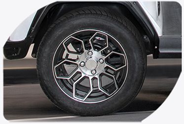 A close-up of a golf cart tire.