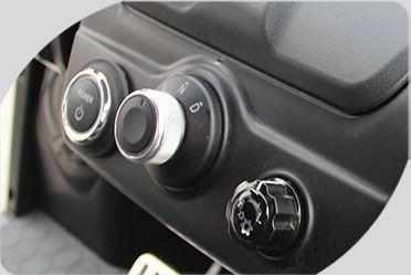 A close up of a car dashboard with buttons and knobs.