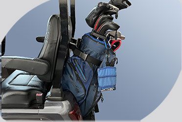 A golf bag is hanging from the back of a golf cart.