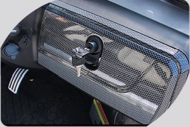A close up of a car dashboard with a key in it.
