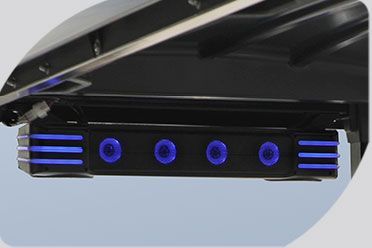 A close up of a speaker with blue lights on it.